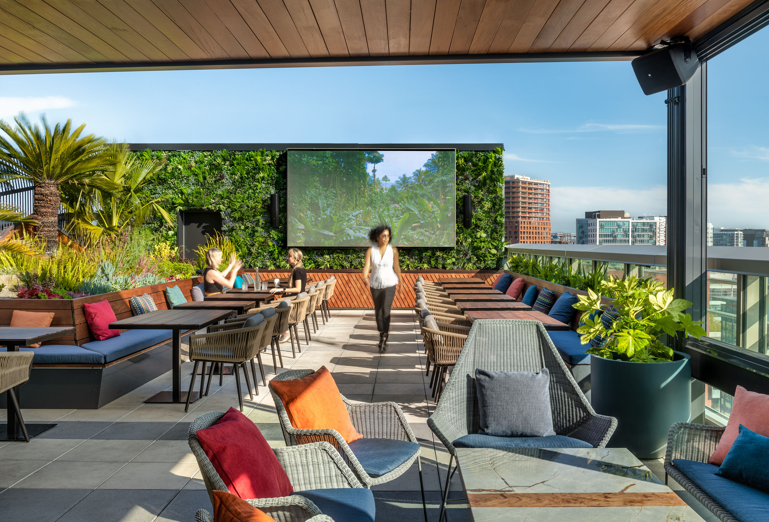 Lush greenery and cozy seating create a tropical oasis at Kaiyo Rooftop, offering a relaxing escape in the heart of San Francisco.